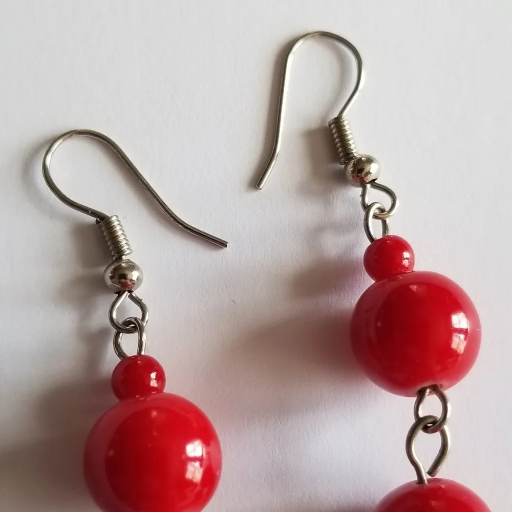 Feather earrings with red beads and flower ball beads silver tone boho